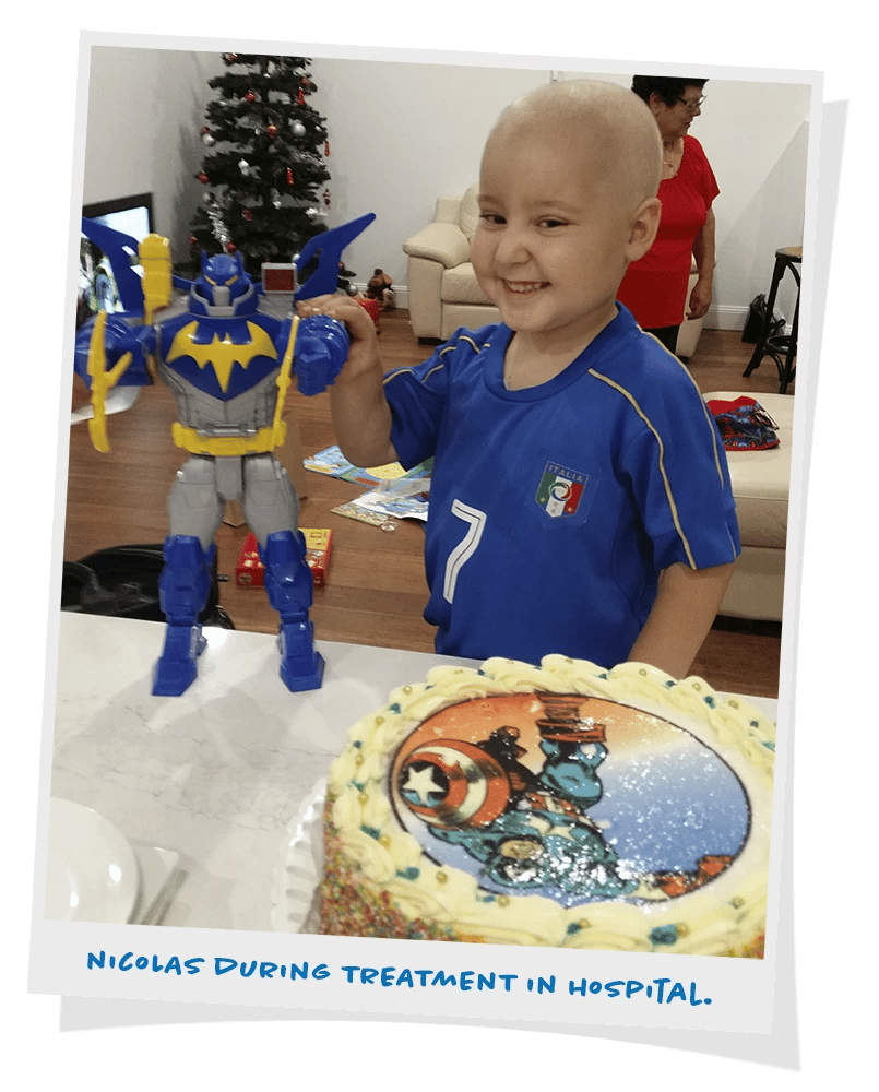 Nicolas celebrating with family and a birthday cake
